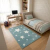 שטיח ילדים כוכבים כחול, Cozy Israeli Children's Bedroom, styled props, Realistic Interior Photography, Dreamy Morning Glow.